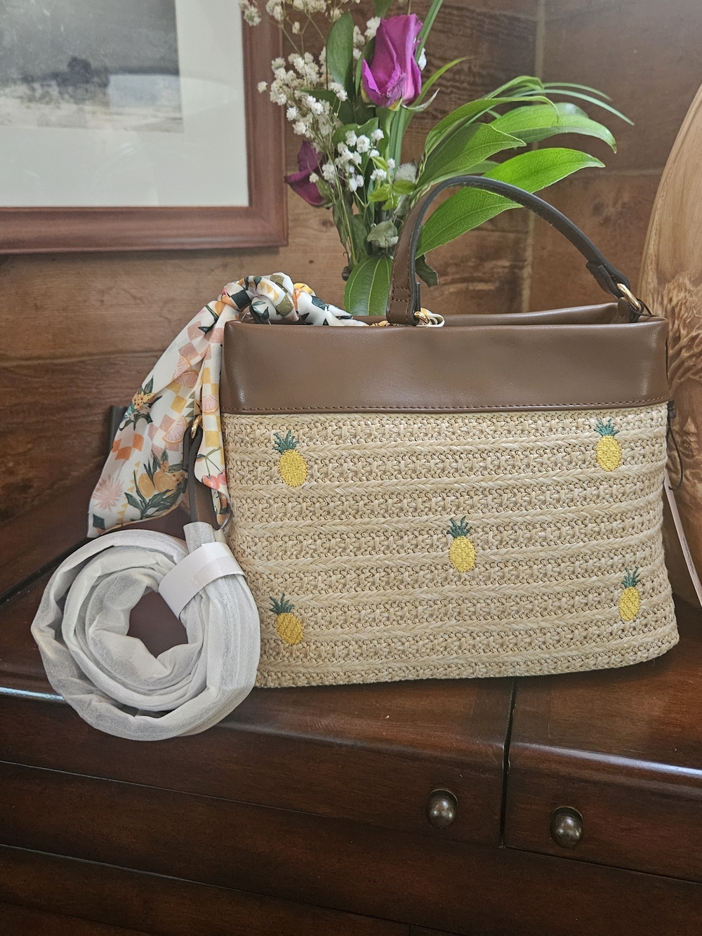 BCBGeneration Straw Shoulder Bag with Brown Trim and Yellow Pineapple Embroidery